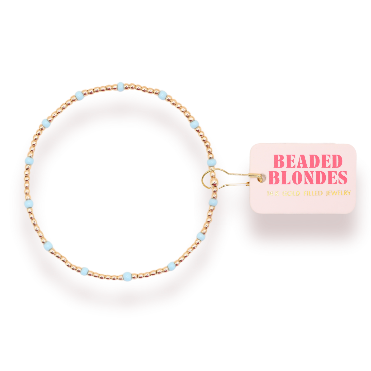 Beaded hair tie with 'Beaded Blondes' packaging on a white background