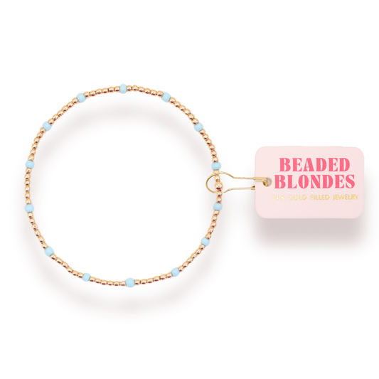 Beaded hair tie with 'Beaded Blondes' packaging on a white background