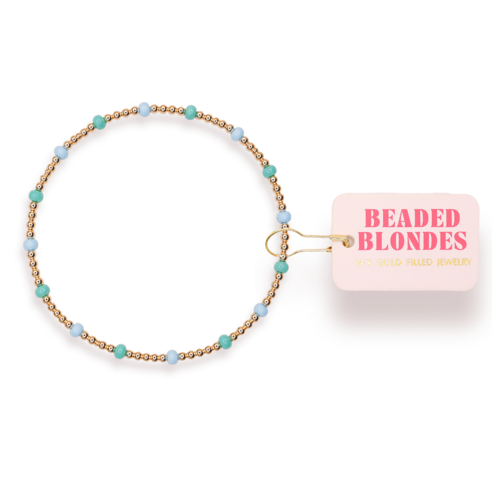 Beaded bracelet with 'Beaded Blondes' packaging on a white background
