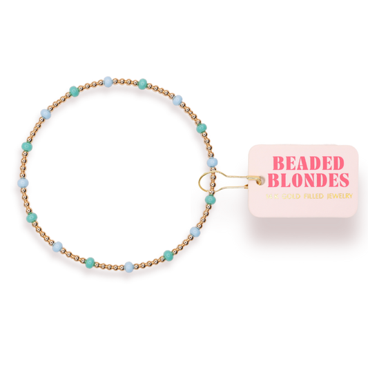 Beaded bracelet with 'Beaded Blondes' packaging on a white background