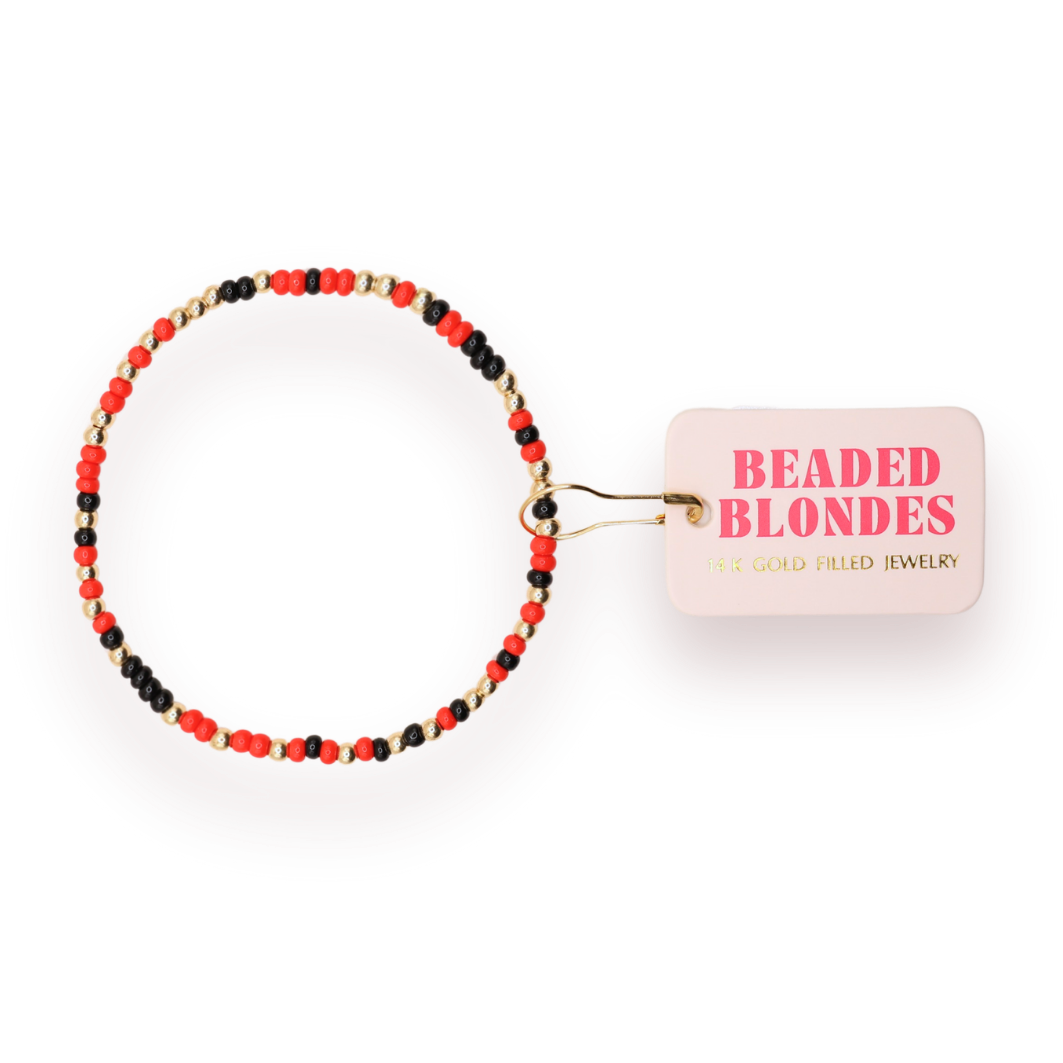Beaded bracelet with a 'Beaded Blondes' card on a white background
