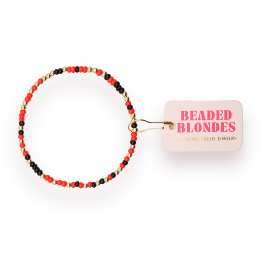 Beaded bracelet with a 'Beaded Blondes' card on a white background