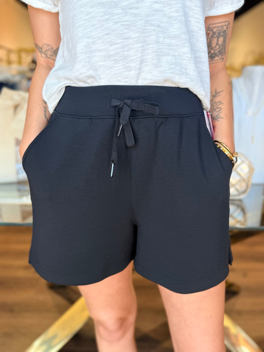 model wearing black shorts