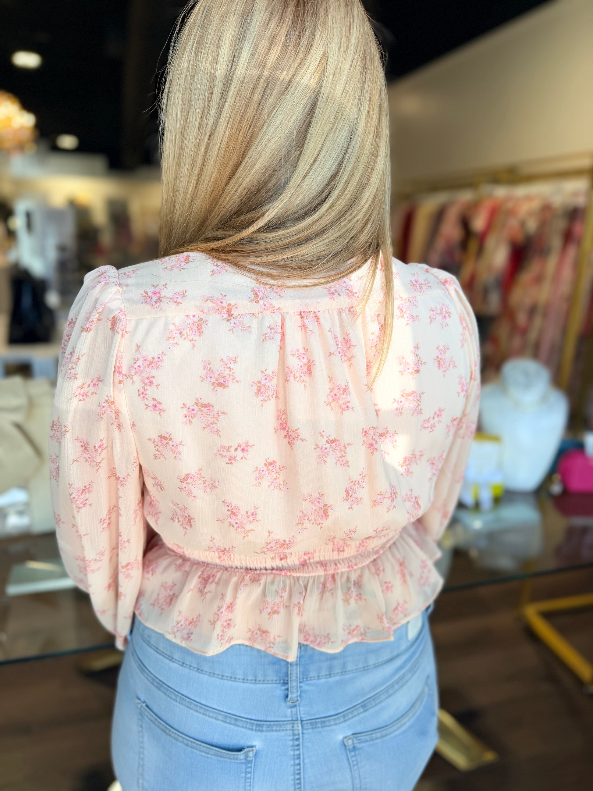 Back of floral blouse top in pink 