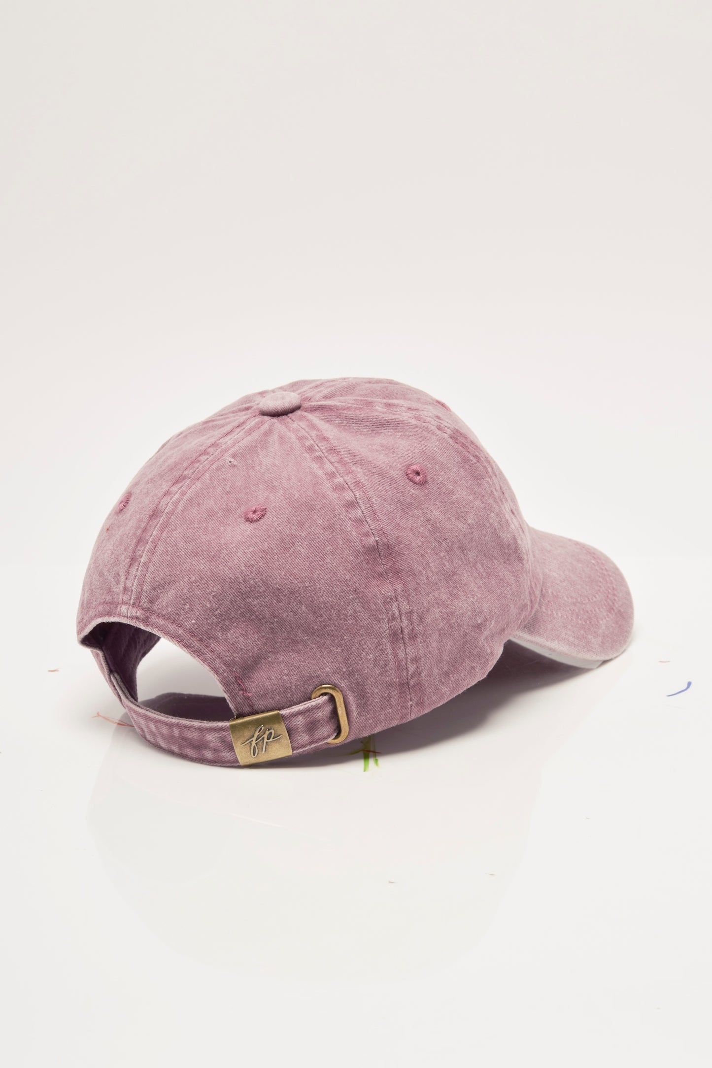 Pink baseball cap on a white background