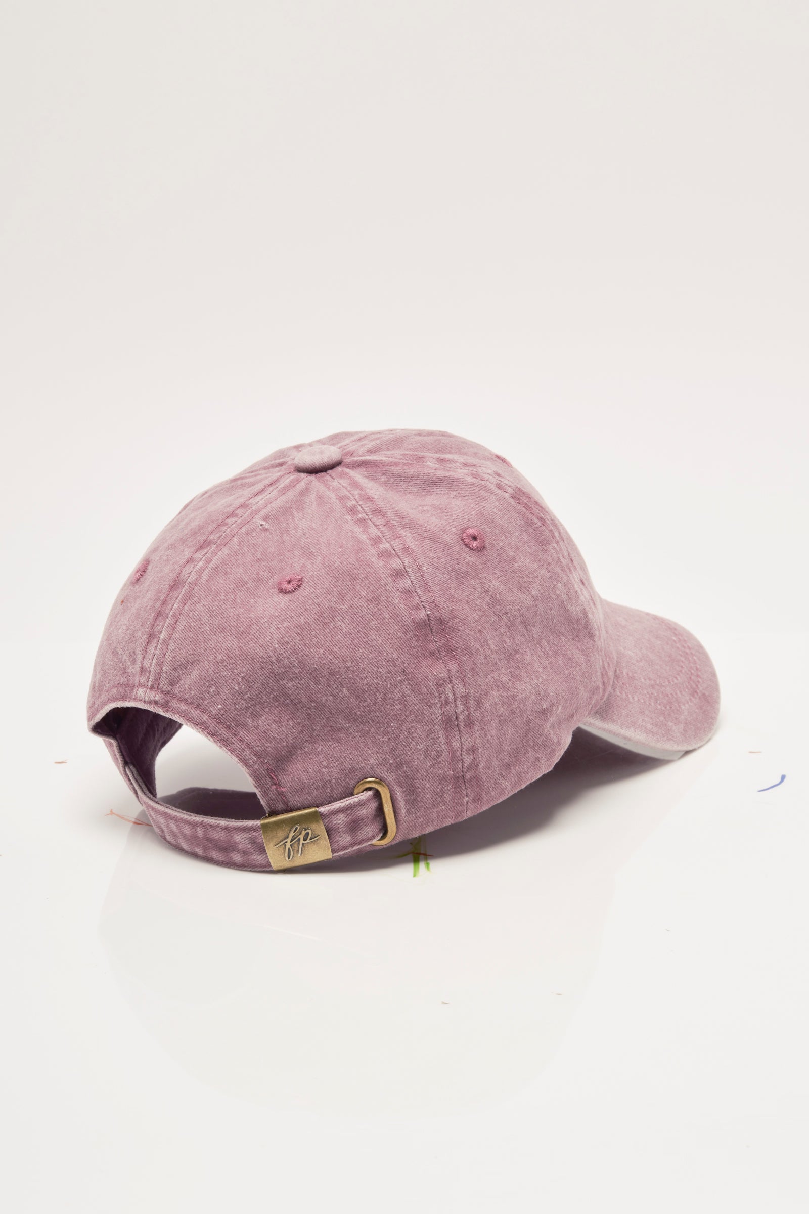 Pink baseball cap on a white background
