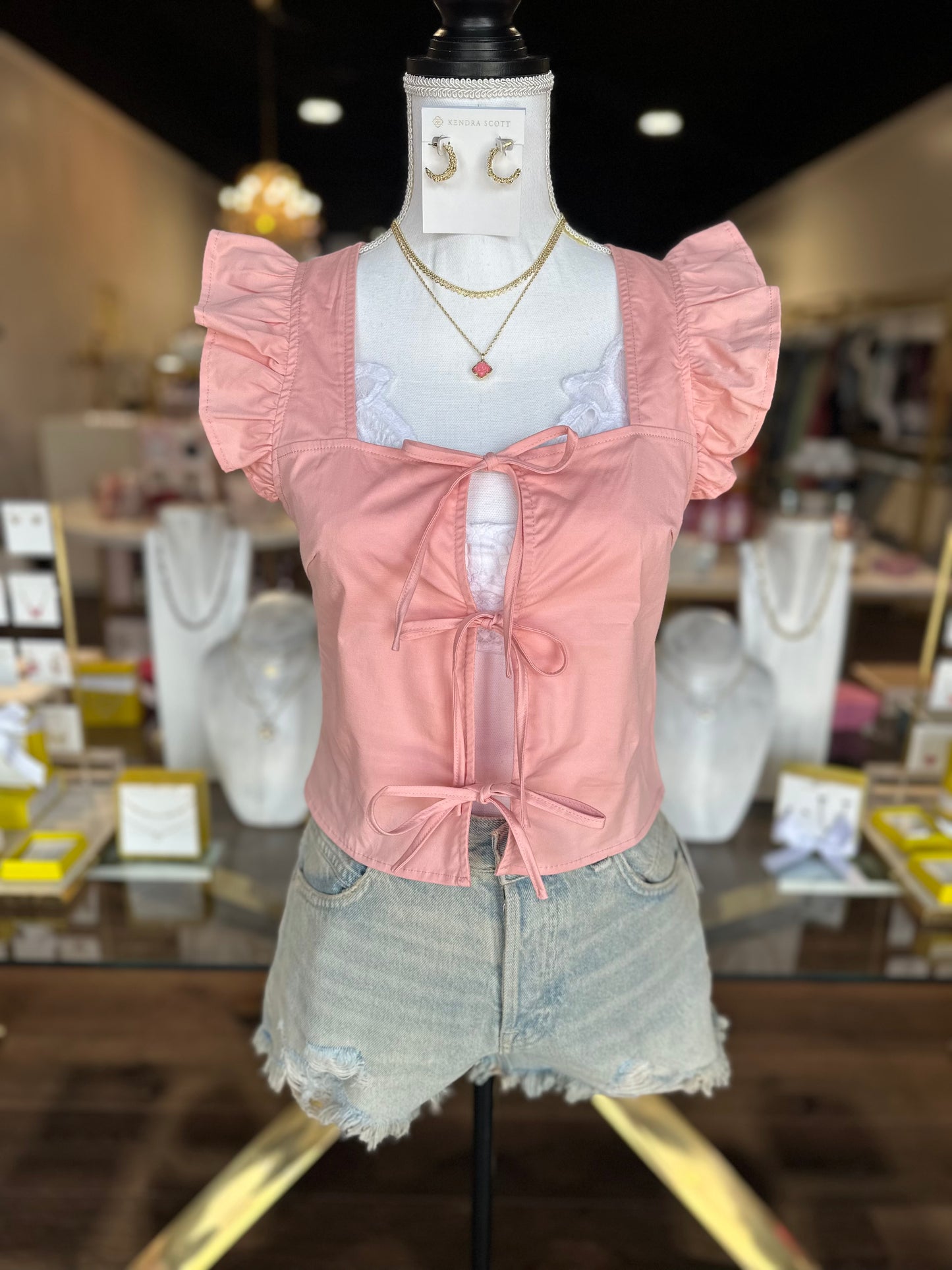 pink tie top with denim shorts 