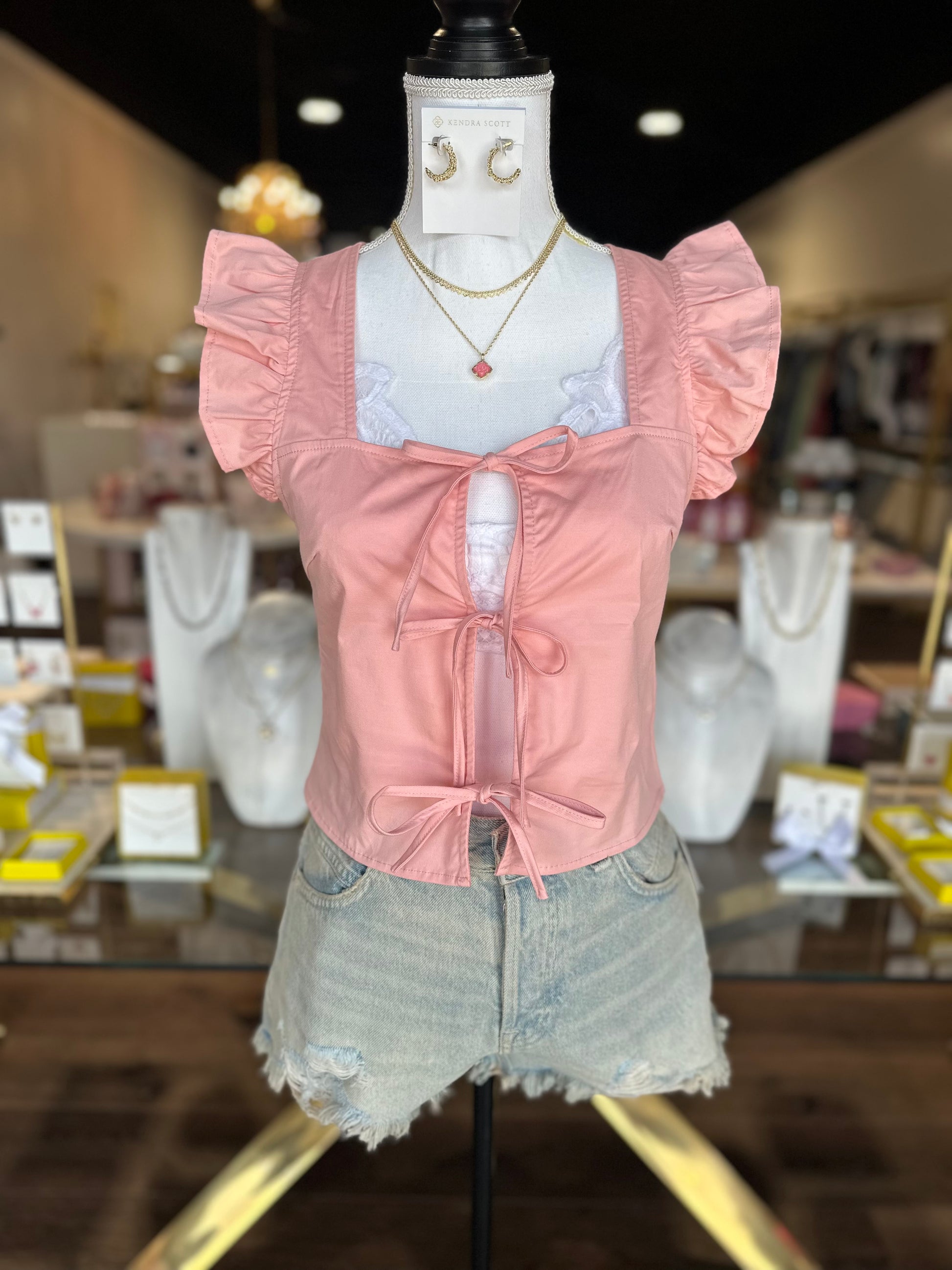 pink tie top with denim shorts 