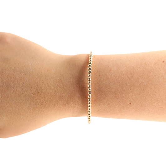 BOUTIQUE BEADED BLONDES 3MM GOLD BRACELET ON ARM