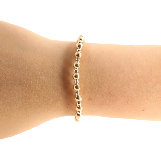 BOUTIQUE BEADED BLONDES GOLD WITH SILVER KATY BRACELET ON ARM