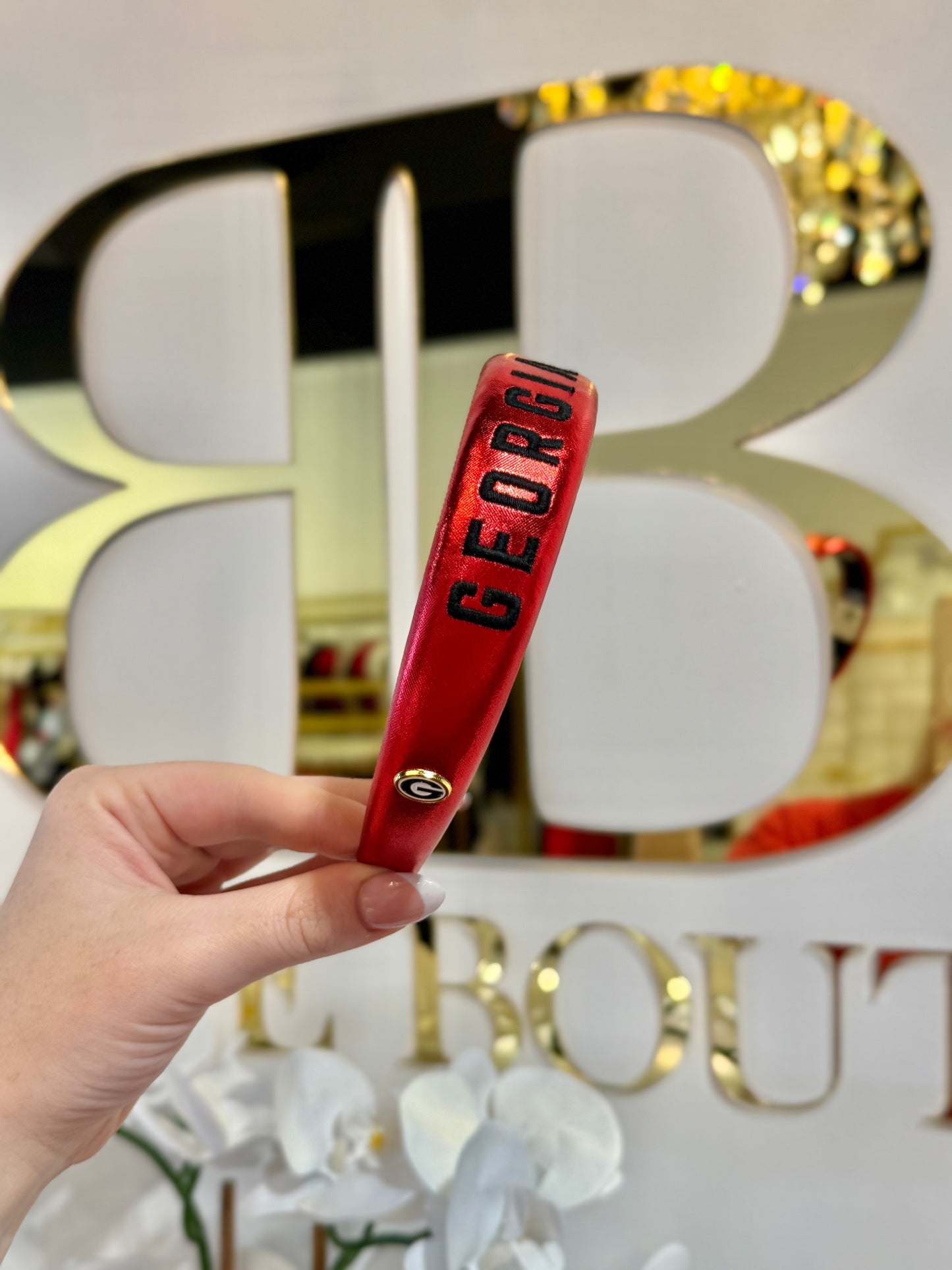 BOUTIQUE BRIANNA CANNON GEORGIA RED METALLIC THIN EMBROIDERED HEADBAND IN HAND