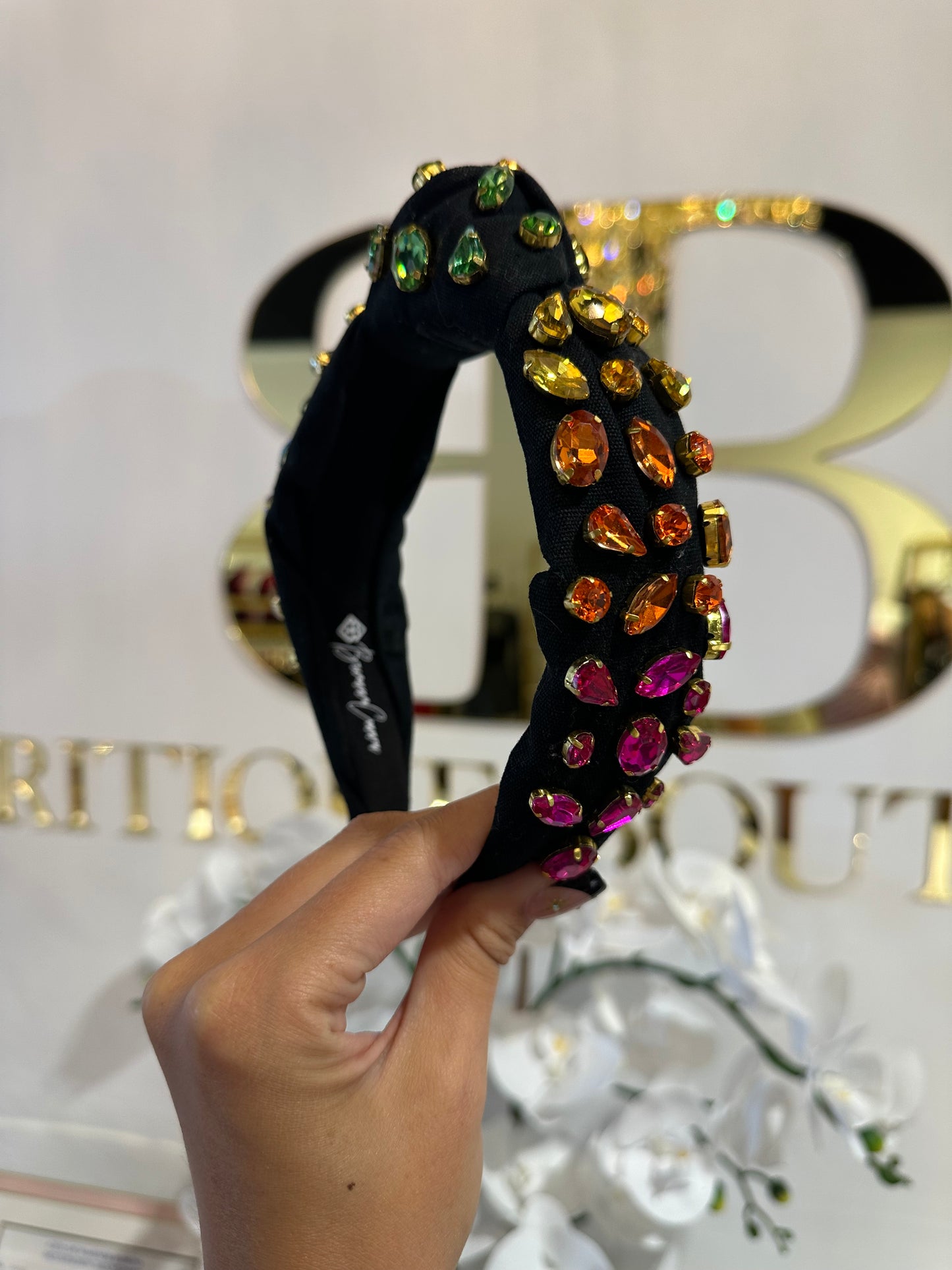 BOUTIQUE BRIANNA CANNON HEADBAND RAINBOW CRYSTALS BLACK IN HAND