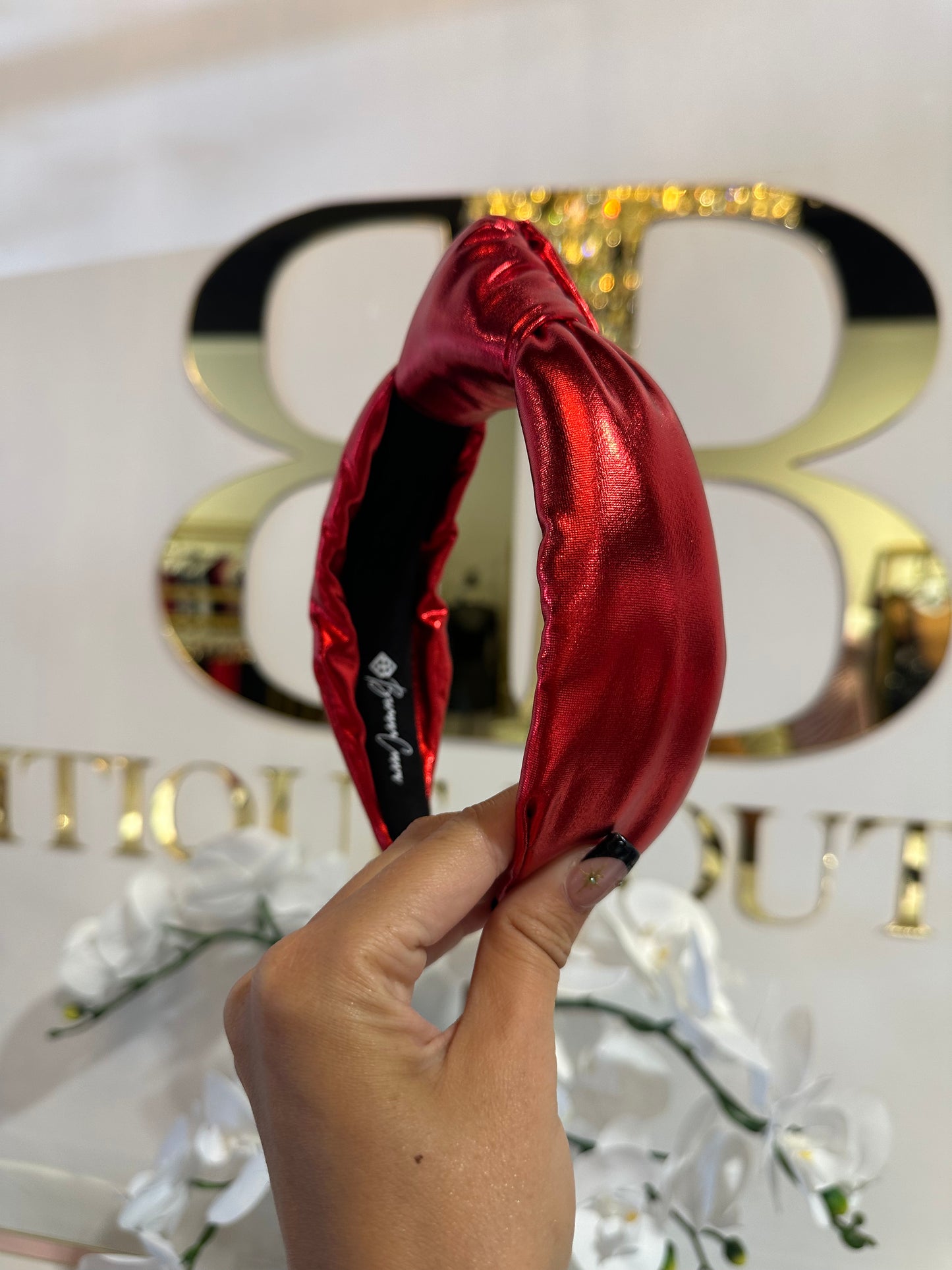 BOUTIQUE BRIANNA CANNON HEADBAND RED METALLIC PUFF IN HAND