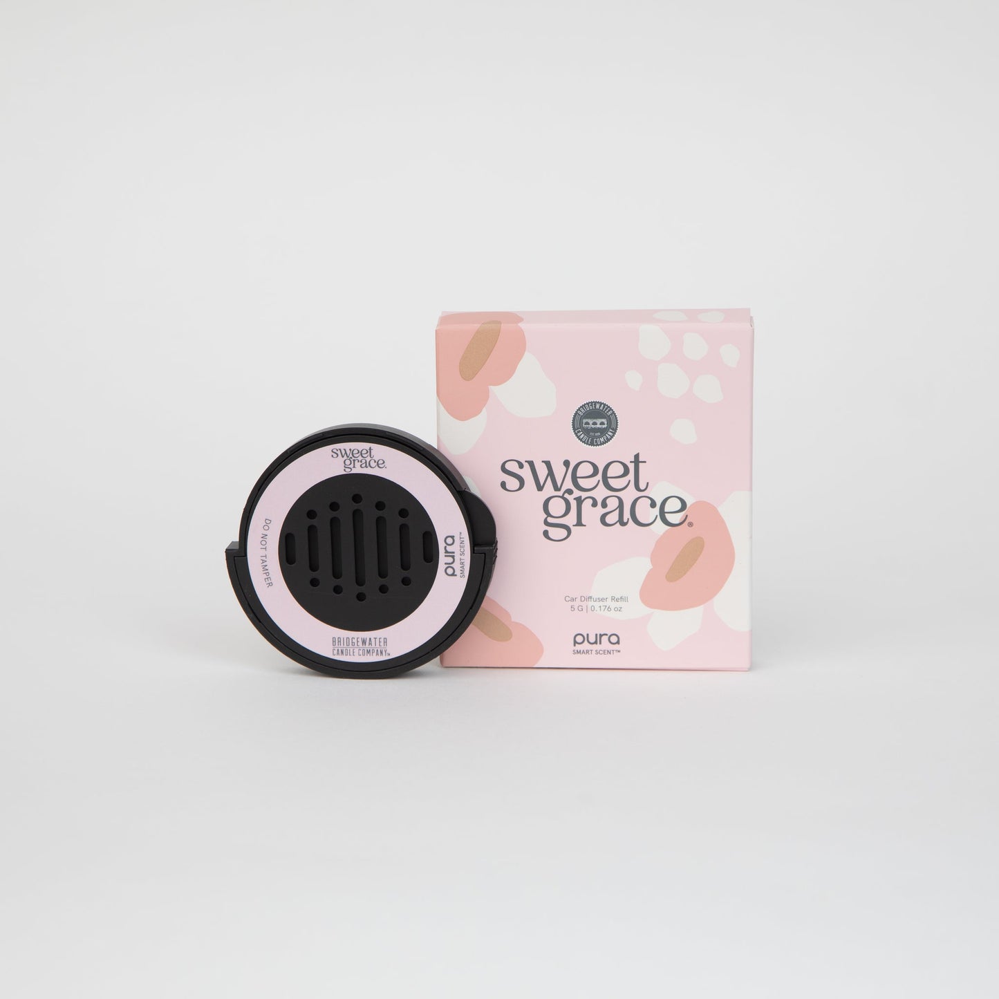 Black device with pink accents and 'sweet grace' packaging on a white background