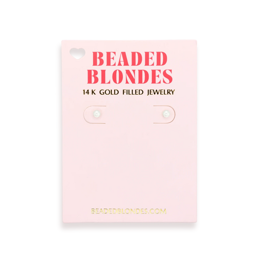 Beaded Blondes 3MM Pearl Stud Earrings displayed on a pink jewelry card.