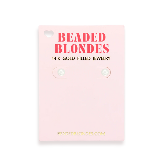 Beaded Blondes 5MM Pearl Stud Earrings displayed on a pink jewelry card.
