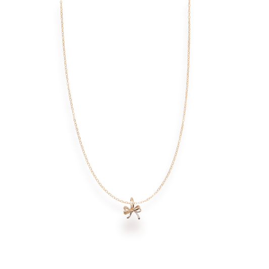 Beaded Blondes Bow Charm Necklace pendant shown close up.