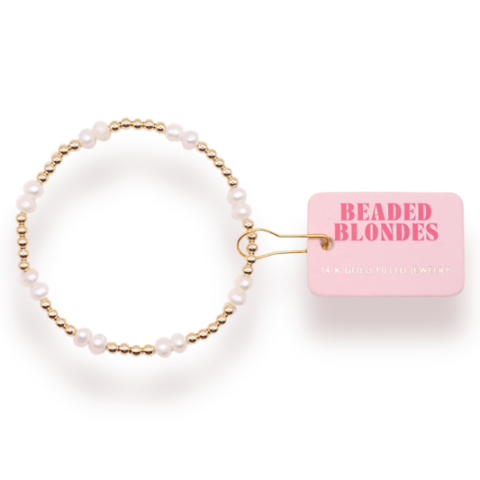 Beaded Blondes Coastal Pearl Bracelet in Gold, showing white freshwater pearls and gold beads beside a brand tag.