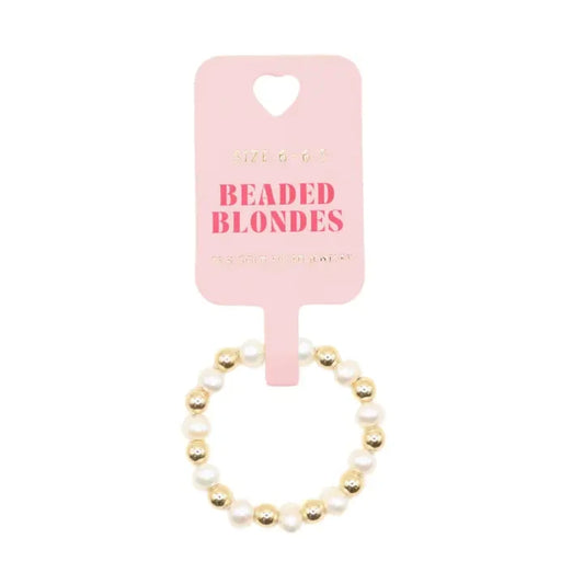 Beaded Blondes Coastal Pearl Ring with white pearls and gold beads on a pink display card.