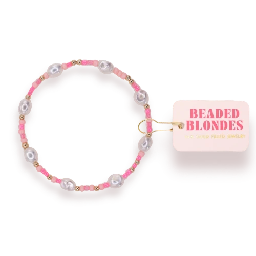 Beaded Blondes Flamingo Sprinkle Pearl Bracelet beside a pink jewelry tag.