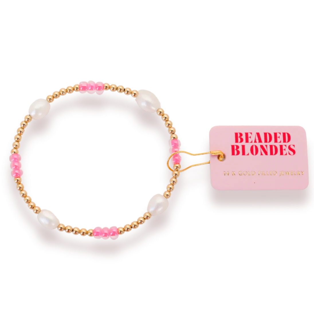 Beaded Blondes Hot Pink Pearl Poppi Bracelet with white pearls, pink accents and gold beads beside a brand tag.