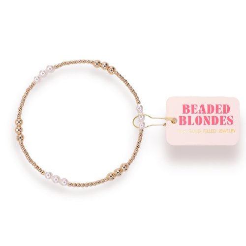 Beaded Blondes ILY Gold and Pearl Alternating Bracelet with white pearls and gold beads beside a pink brand tag.