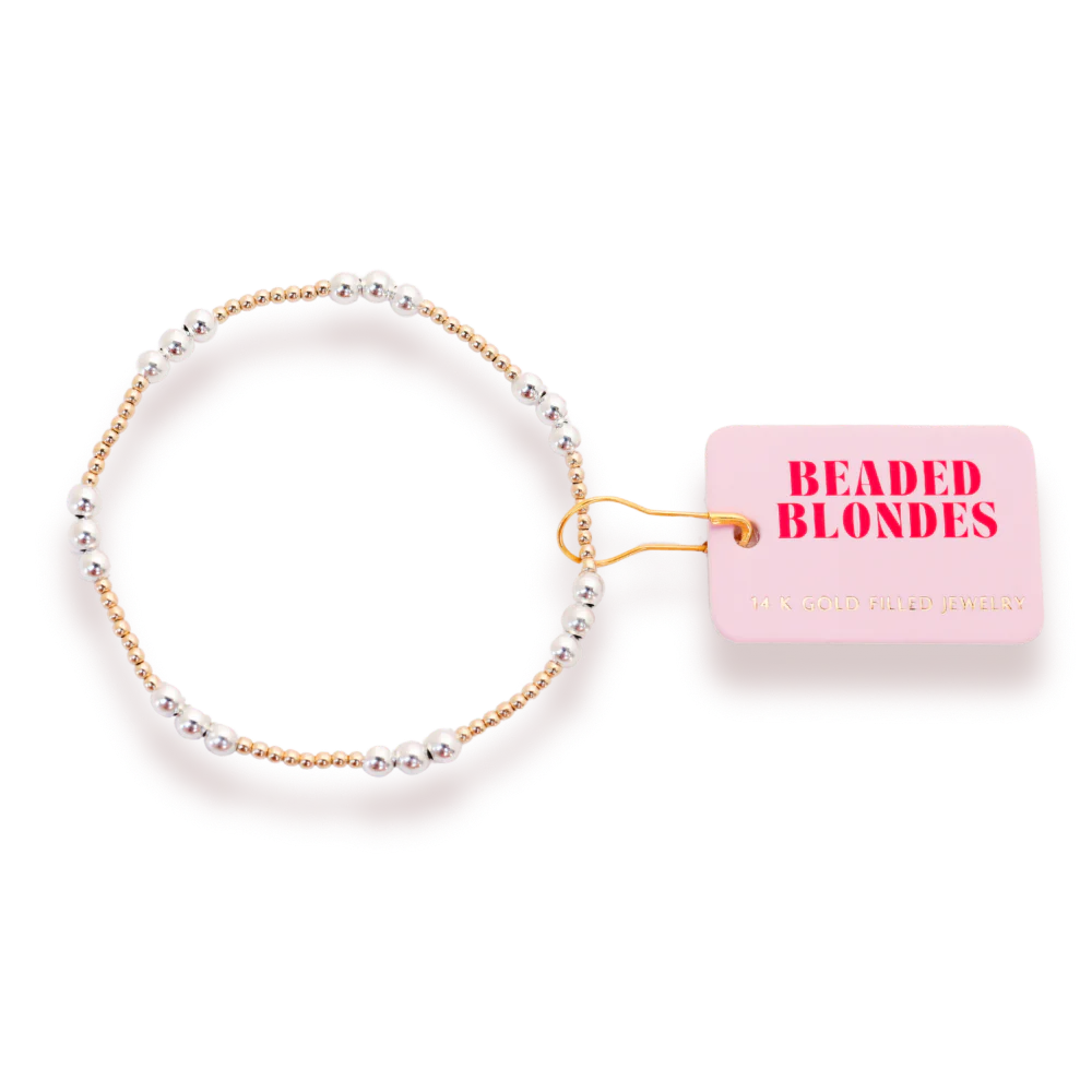 Beaded Blondes ILY Bracelet in Gold with Silver, showing three contrasting accent beads beside a pink tag.
