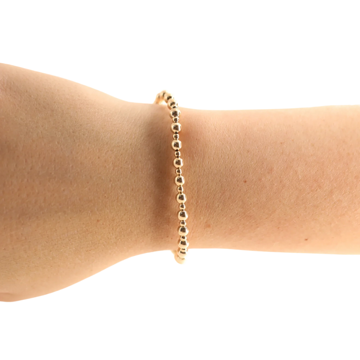 Beaded Blondes Katy Mini Bracelet in Gold worn alone on a wrist.