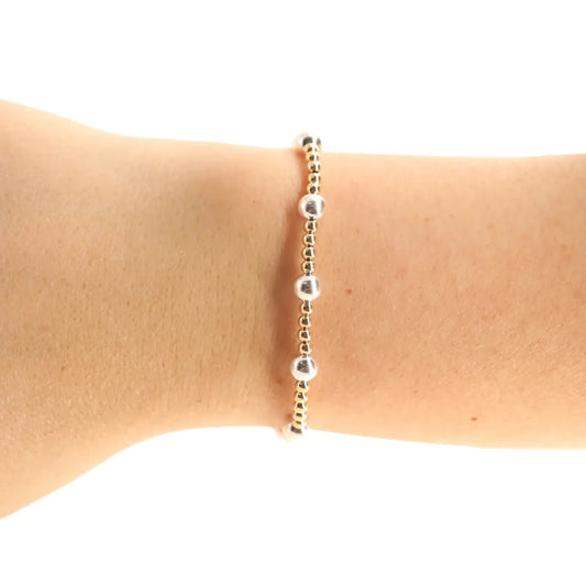 Beaded Blondes Lively Bracelet in Gold with Silver worn alone on a wrist.