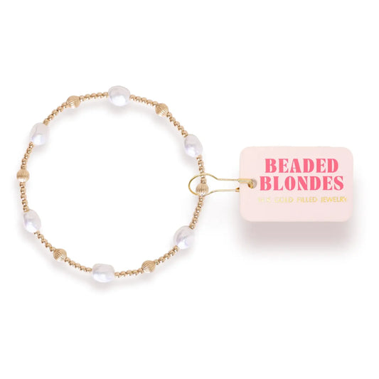 Beaded Blondes Maggie Fluted Bracelet in Gold with white pearls, fluted gold beads and a pink tag.