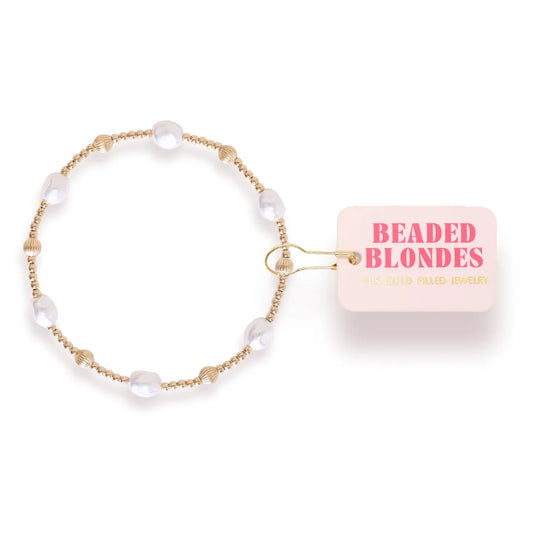 Beaded Blondes Maggie Fluted Bracelet in Gold with white pearls, fluted gold beads and a pink tag.