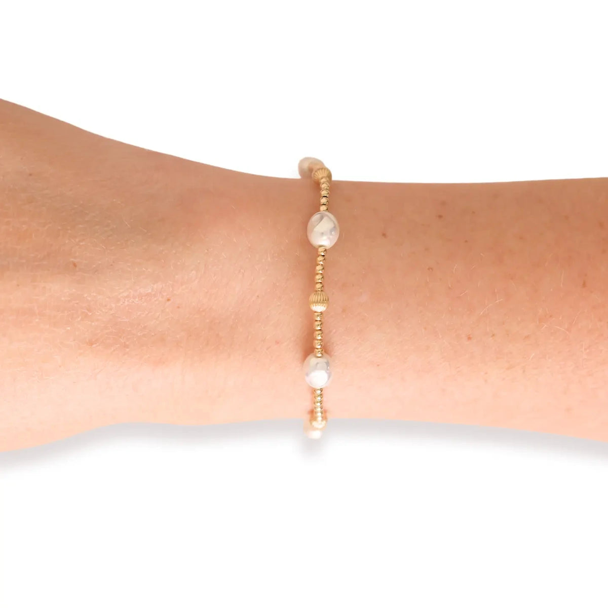 Maggie Fluted Bracelet with alternating pearls and gold beads worn alone on a wrist.