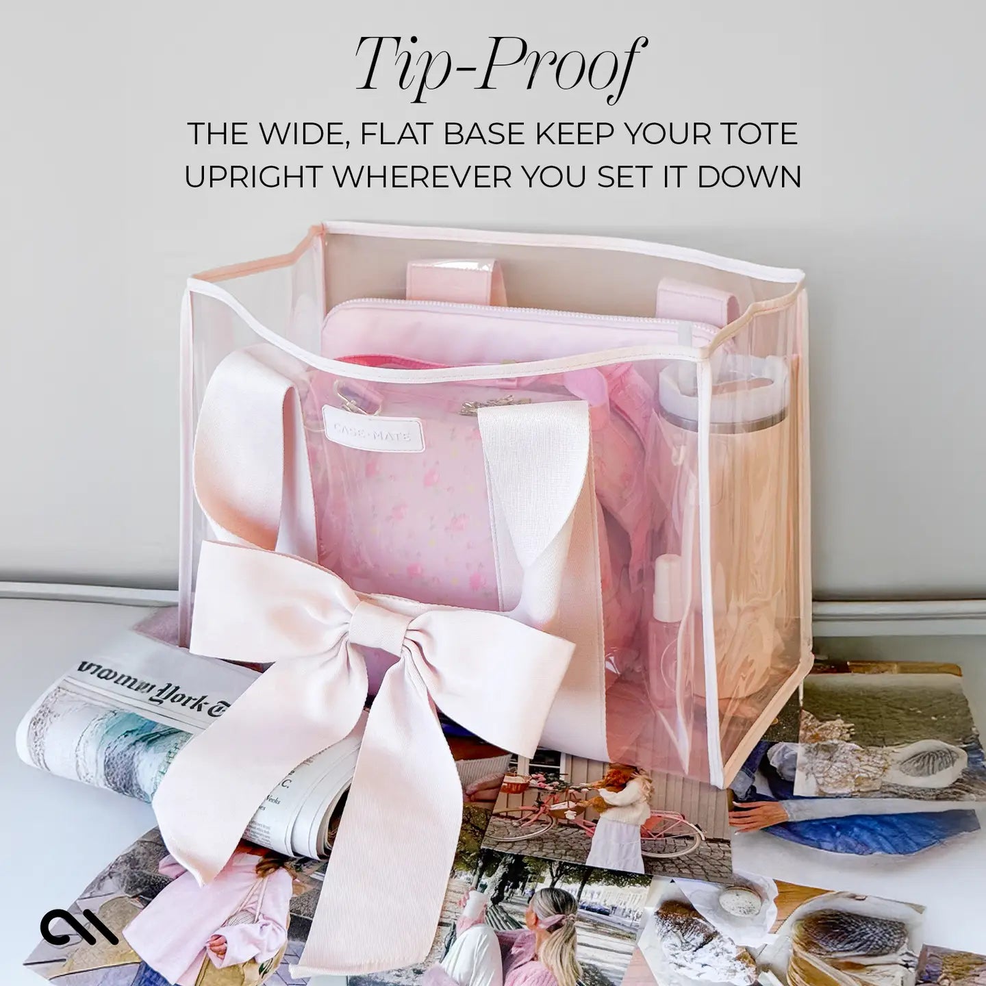 Pink CASE-MATE bow tote bag with a clear cover on a surface with text about its stability.