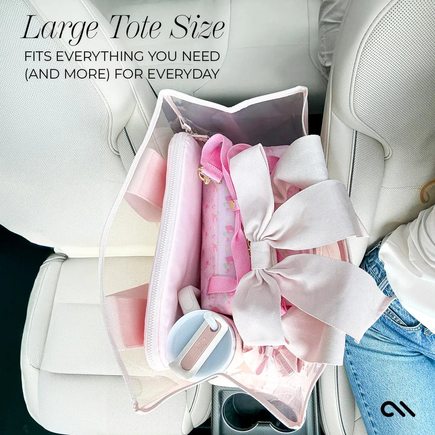 Large CASE-MATE balled pink clear tote bag filled with pink items on a car seat