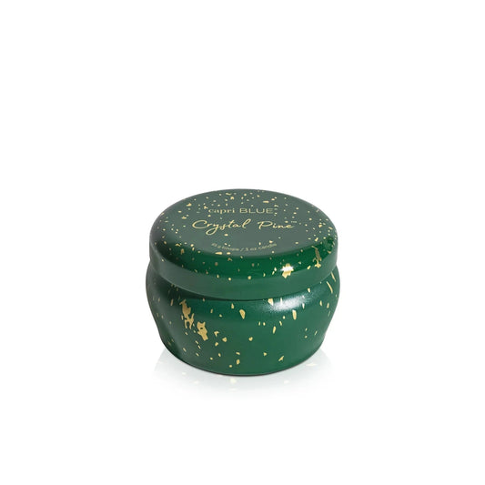 Capri Blue Crystal Pine Glimmer Mini Tin Candle in emerald green with gold speckles, lid view.