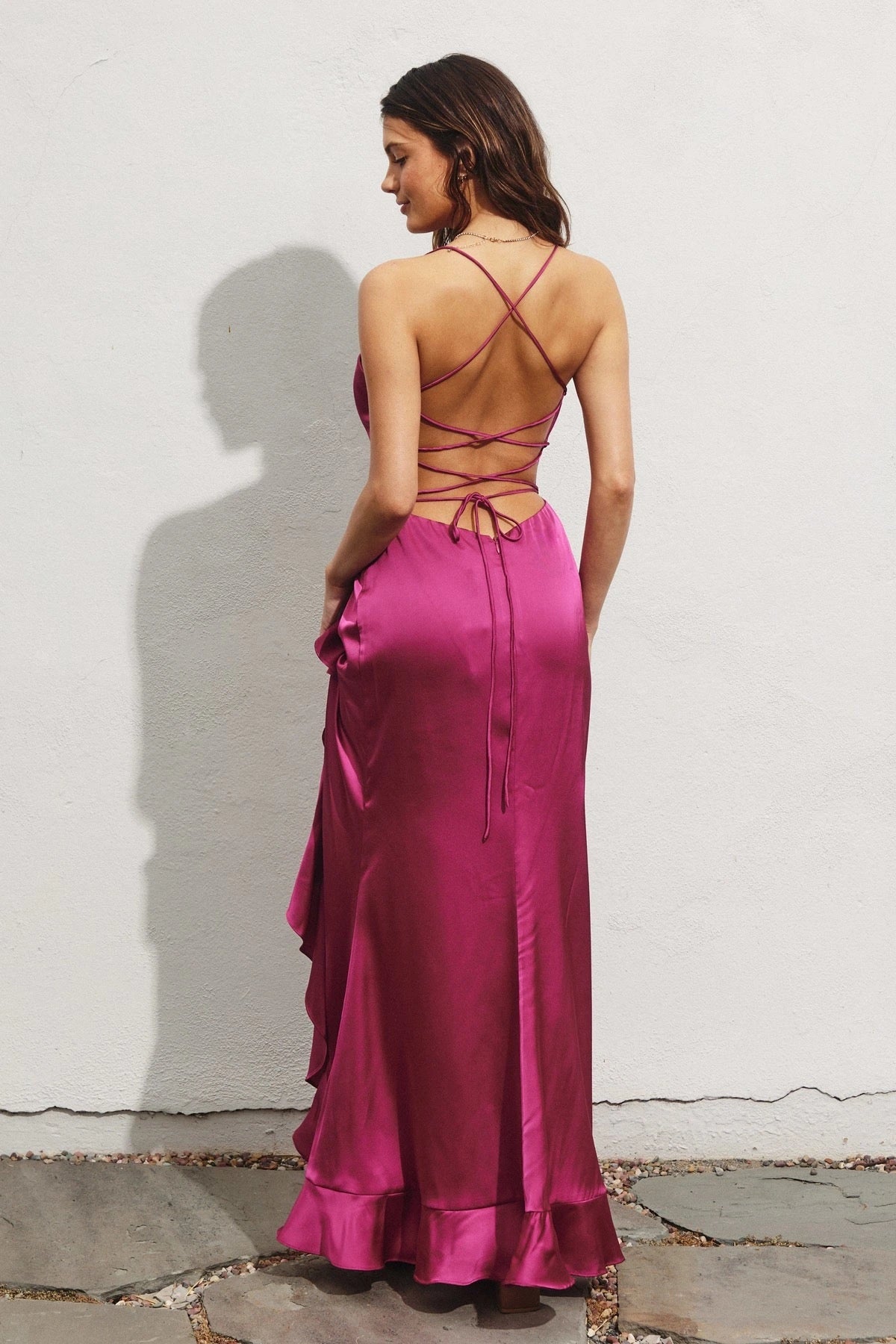 DRESS FORUM Going Out Open Back Ruffled Maxi Dress in Magenta, back view.