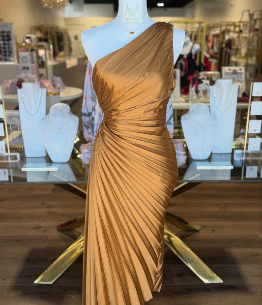 Dress Forum Olympia gold-toned one-shoulder pleated dress on a boutique mannequin, front view.