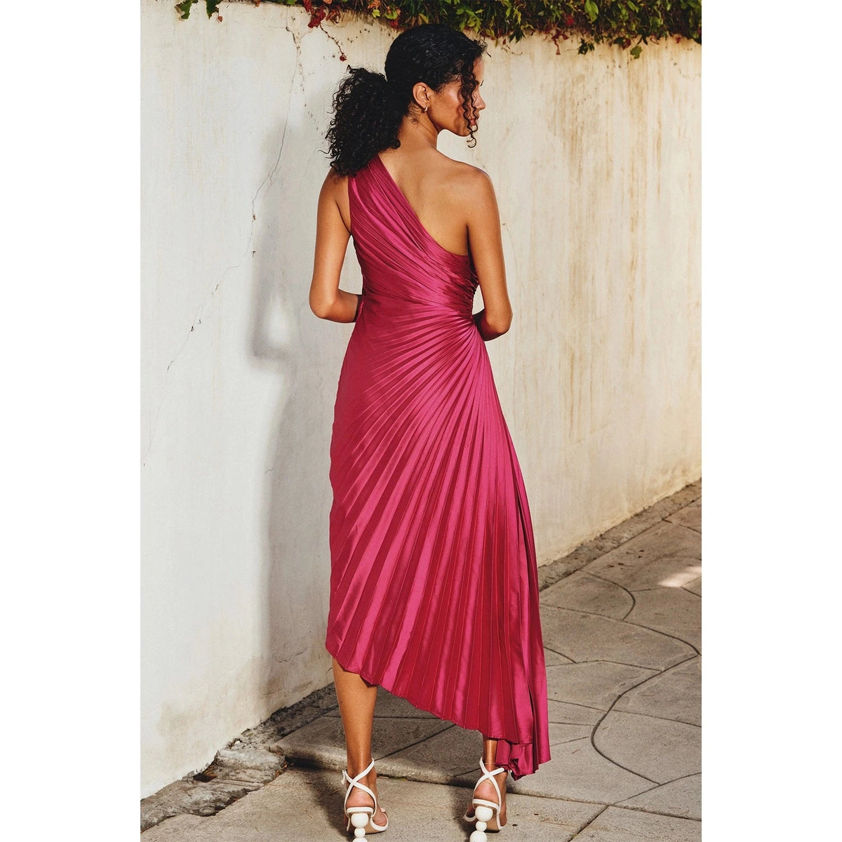 DRESS FORUM Olympia Asymmetrical Pleated Dress in Viva Magenta, back view.