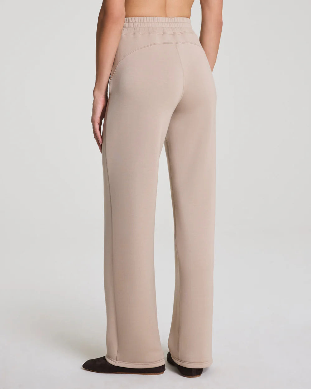 BRITIQUE BOUTIQUE MODEL WEARING SPANX STRAIGHT LEG PANTS IN DUNE