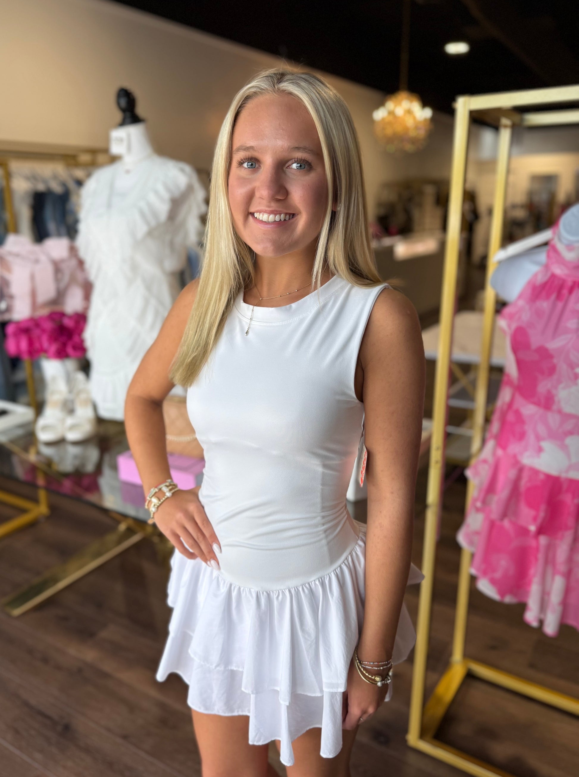 Britique Boutique model wearing Free People Field Day Skortsie in white with store background 