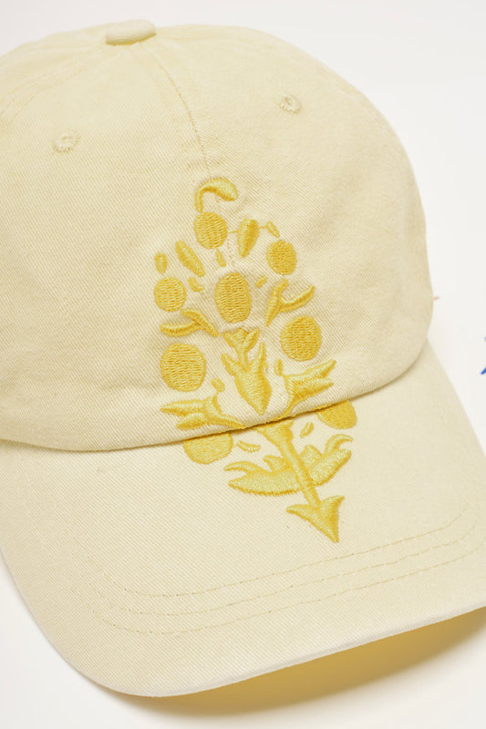 Free People Movement Big Buti Baseball Cap in Daylight Tonal, close-up of the yellow floral embroidery.
