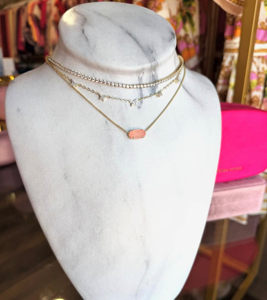 Necklace on a marble bust with a blurred background