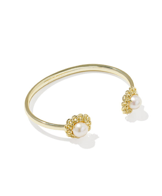 Gold Kendra Scott bracelet with pearl accents on a white background