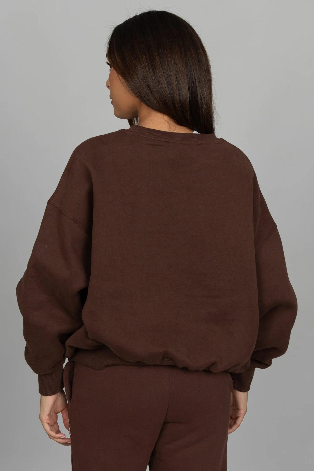 Back view of the GOLD HINGE GH Wide Arm Sweatshirt in Dark Brown