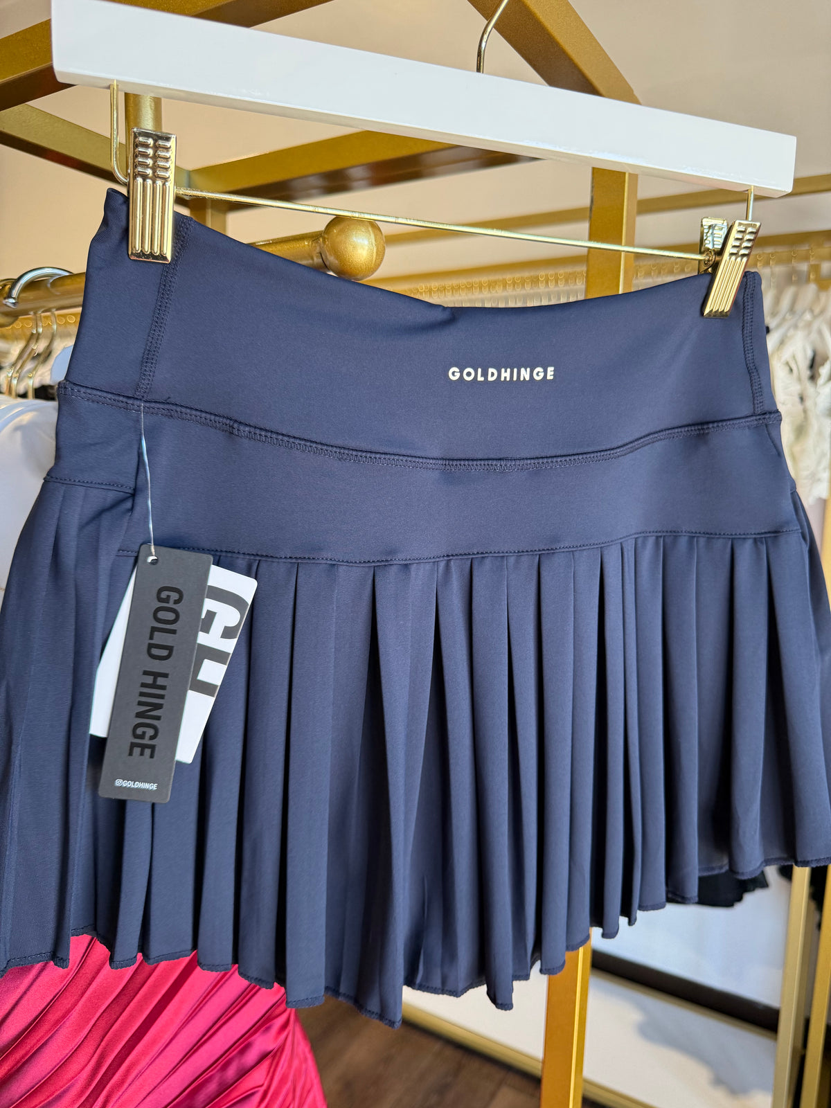 Additional view of the Gold Hinge pleated tennis skirt in Dark Navy