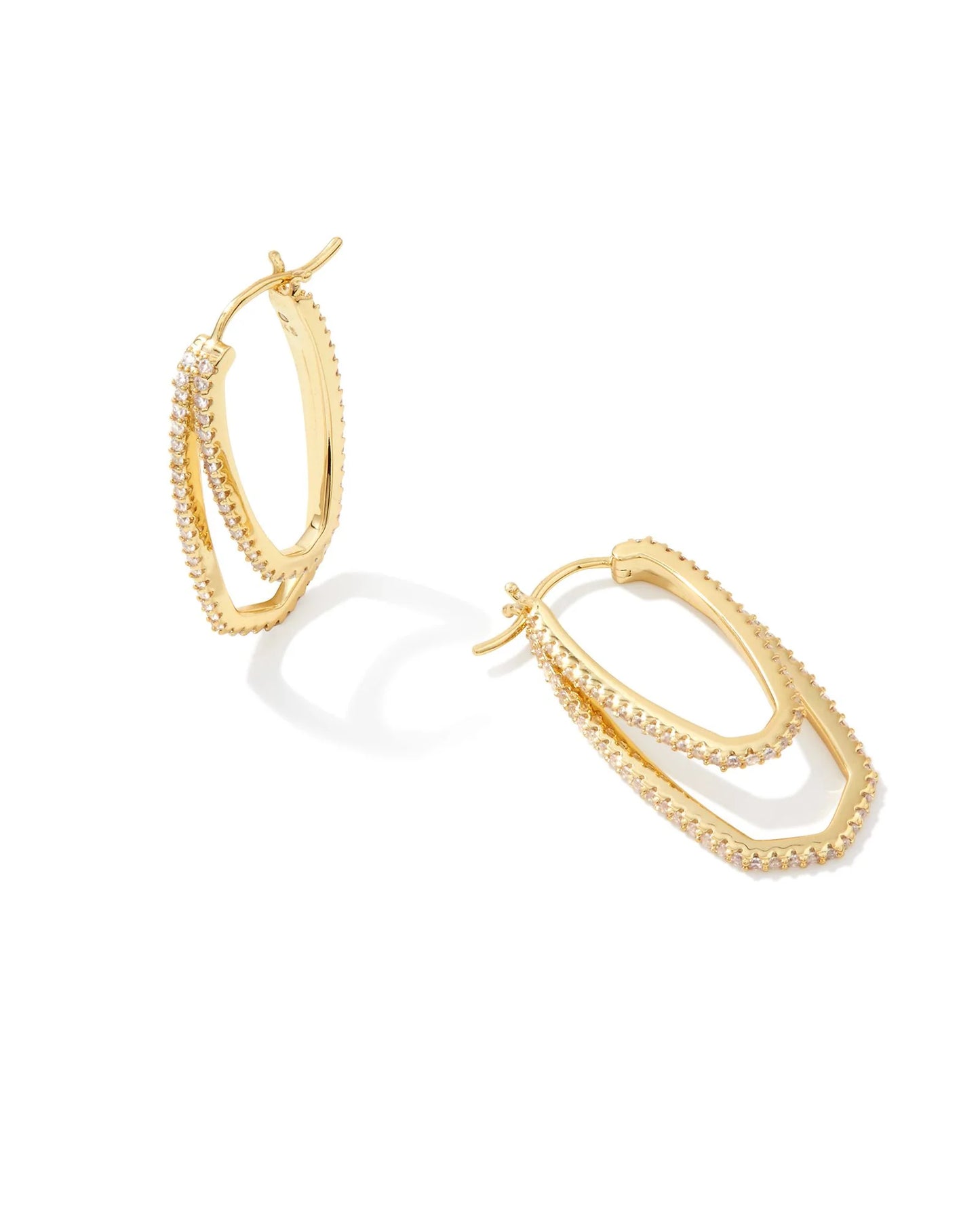 Gold Kendra Scott hoop earrings on a white background