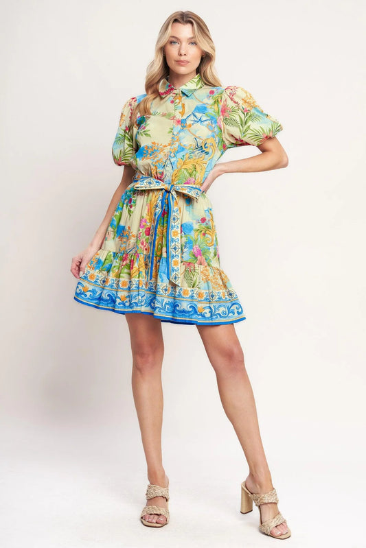 Woman wearing a colorful floral dress on a white background