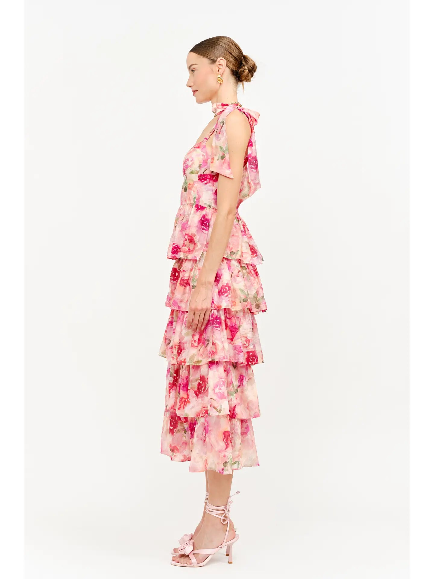 model wearing floral dress standing to the side
