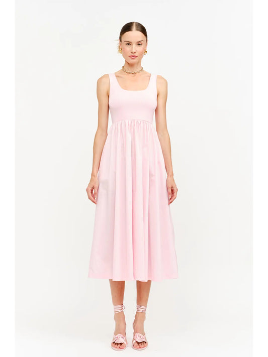 model wearing a pink maxi dress standing to the front