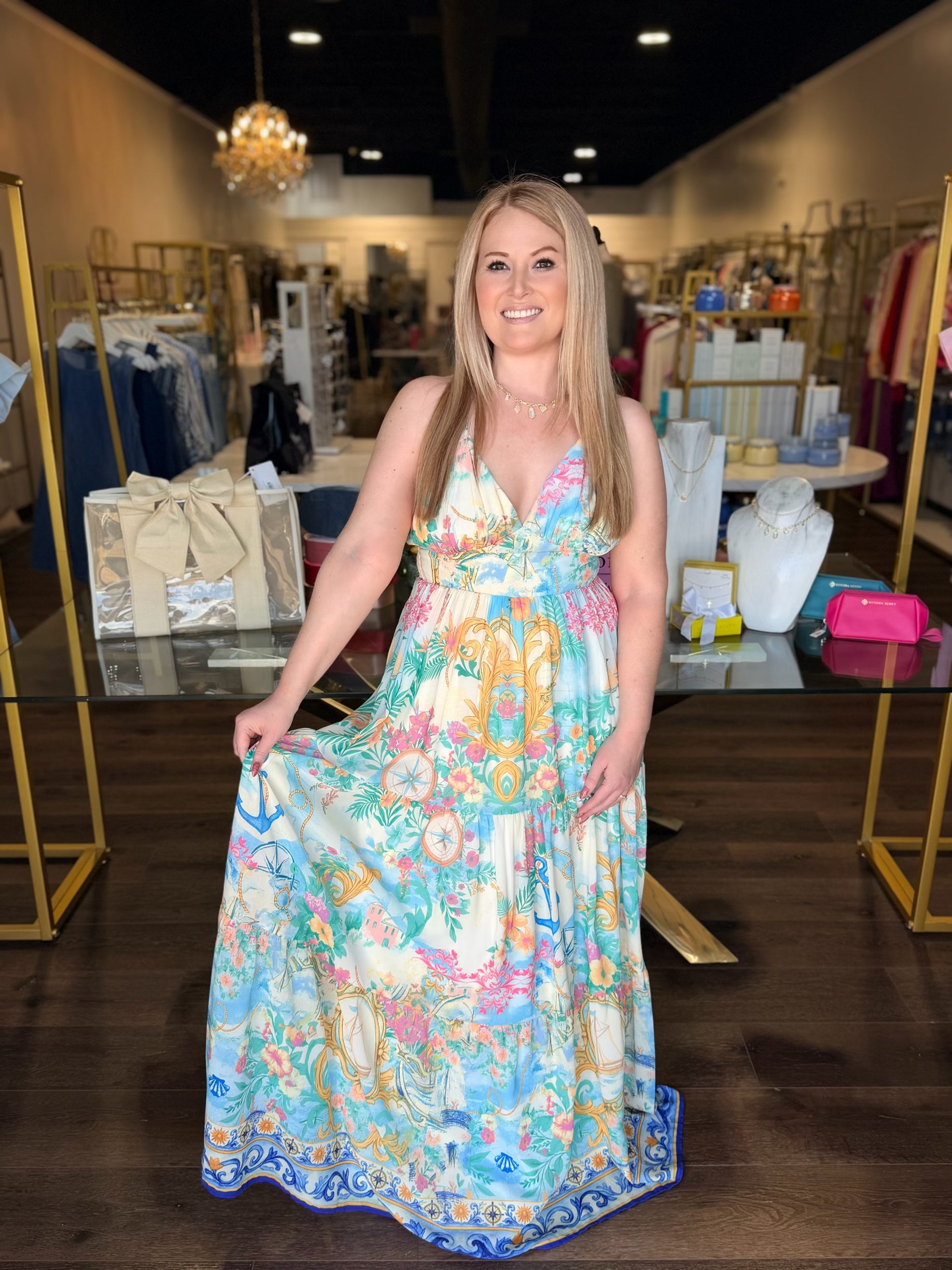 Woman wearing a floral dress in a store setting
